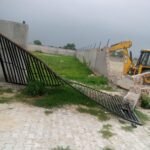 GDA bulldozer rolls over illegal colony sprawling across 45,000 square meters in village Galand IMAGE CREDIT TO GDA