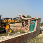 In the submerged area of Tughlakpur, the Greater Noida Authority carried out a bulldozer operation, freeing 40,000 square meters of land IMAGE CREDIT TO AUTHORITY