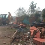 GDA bulldozer runs on illegal colony spread over 70 bighas, more than 100 plots demolished IMAGE CREDIT TO AUTHORITY