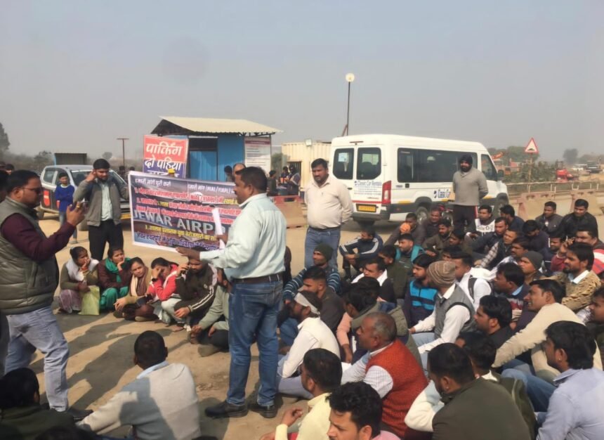 Airport affected youth adamant on the demand for permanent employment, staged a sit-in at Jewar airport gate IMAGE CREDIT TO REPORTER