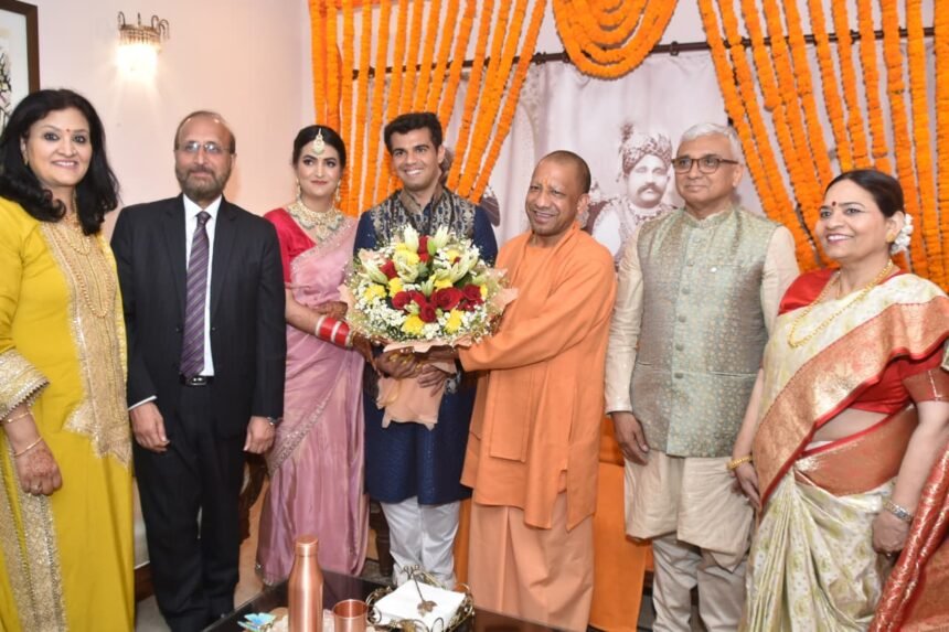 Chief Minister Yogi Adityanath Attends Wedding of Vice-Chancellor Dr. Surendra Singh’s Daughter, Blesses Newlyweds with ‘One District, One Product’ Gifts IMAGE CREDIT TO REPORTER