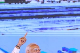 The historic inauguration of Jewar Airport took place under mobile phone lights, with chants of “Modi-Modi” echoing through the crowd. IMAGE CREDIT TO सूचना विभाग