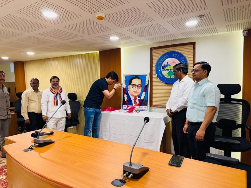 On the occasion of the 35th birth anniversary of Bhimrao Ramji Ambedkar, officials at the municipal corporation offered floral tributes to his portrait. IMAGE CREDIT TO NAGAR NIGAM