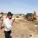Bulldozer action against encroachment in the Bisrakh floodplain area; 25,000 square meters of land freed. IMAGE CREDIT TO प्राधिकरण