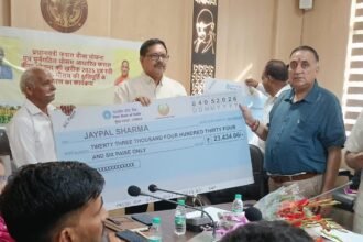 A crop insurance compensation distribution program was held under the chairmanship of the Chief Development Officer, in which symbolic cheques were distributed to 10 farmers. IMAGE CREDIT TO सूचना विभाग