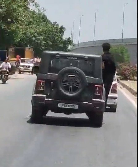“Hanging out of a Thar while doing stunts proved costly; a ₹12,000 challan was issued after the video went viral.” — IMAGE CREDIT TO पुलिस