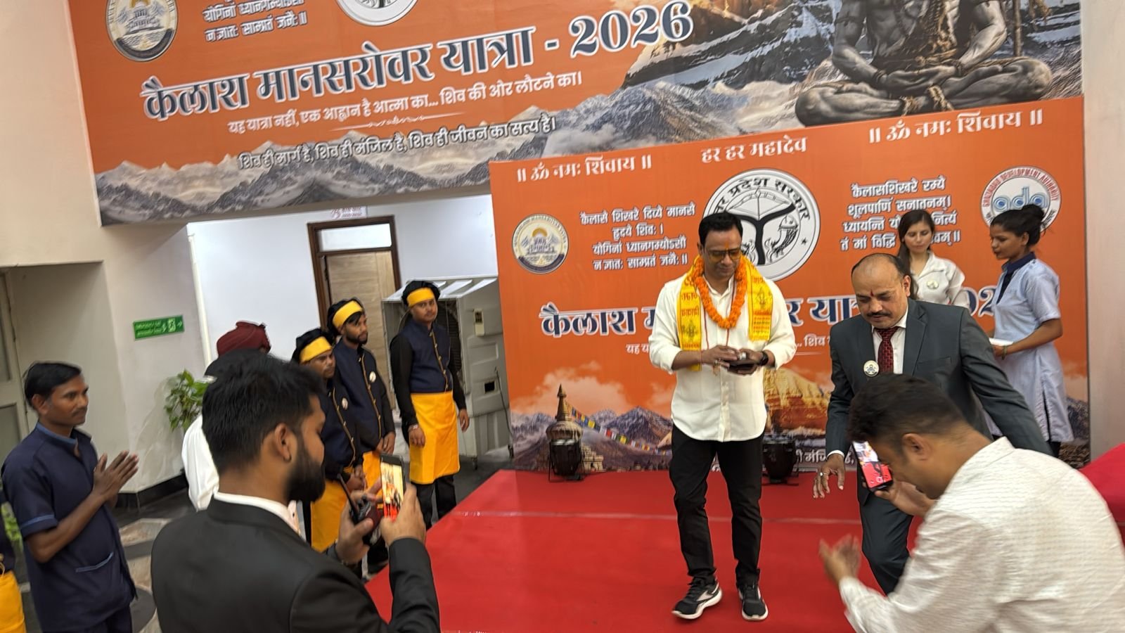 Kailash Mansarovar Yatra 2026: The chants of “Bam Bam Bhole” echoed at Kailash Mansarovar Bhavan, where the GDA gave a grand welcome to Shiva devotees. IMAGE CREDIT TO प्राधिकरण