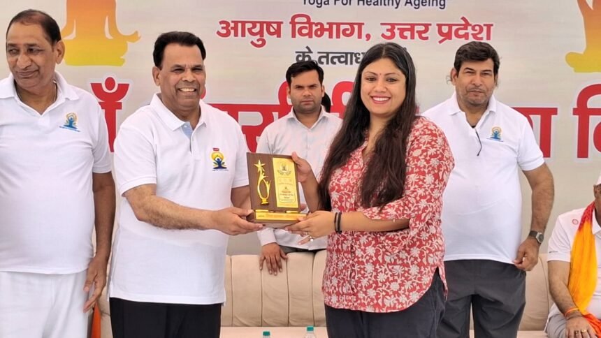 On the 12th International Yoga Day, Gautam Buddh Nagar became immersed in yoga, with thousands of people participating in a mass yoga session. IMAGE CREDIT TO सूचना विभाग
