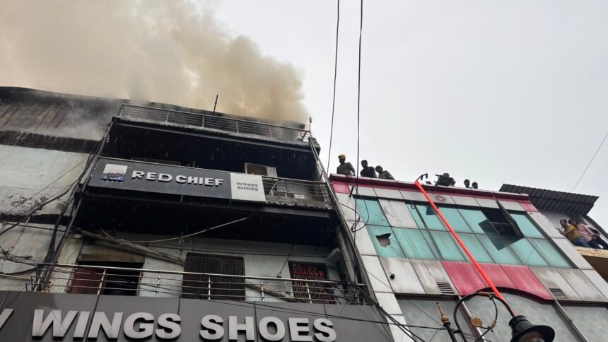 Massive Fire Breaks Out at Wings Shoes Showroom in Ghantaghar; Fire Department Brings Blaze Under Control IMAGE CREDIT TO फायर डिपार्मेंट