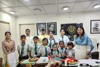 Students of American EduGlobal Academy Tie Rakhi to the District Magistrate — IMAGE CREDIT TO सूचना विभाग