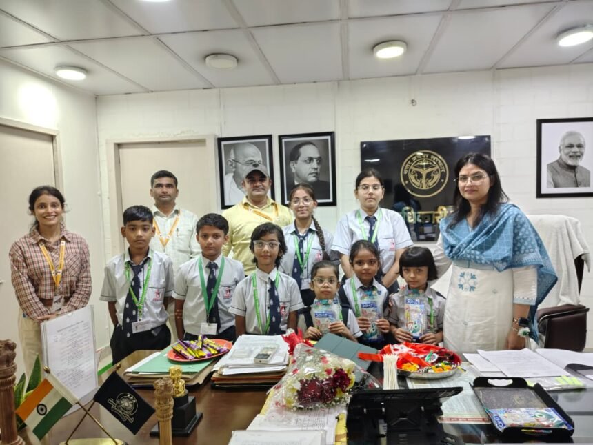 Students of American EduGlobal Academy Tie Rakhi to the District Magistrate — IMAGE CREDIT TO सूचना विभाग