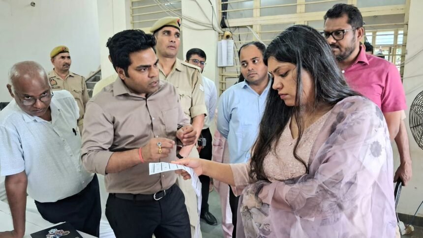 Writing District Magistrate Reviews Preparations for FLC at EVM-VVPAT Warehouse IMAGE CREDIT TO सूचना विभाग