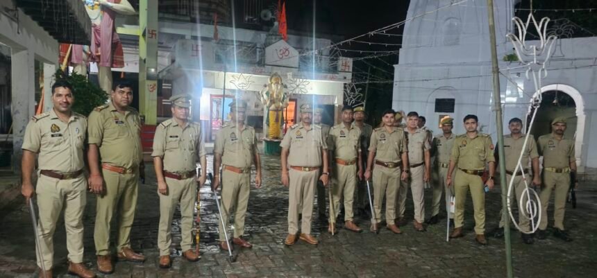 Jewar Police Conducts Foot Patrol Ahead of Janmashtami Procession and Kabaddi Competition IMAGE CREDIT TO पुलिस
