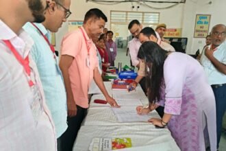 District Election Officer Reviews FLC Work at Warehouse IMAGE CREDIT TO सूचना विभाग