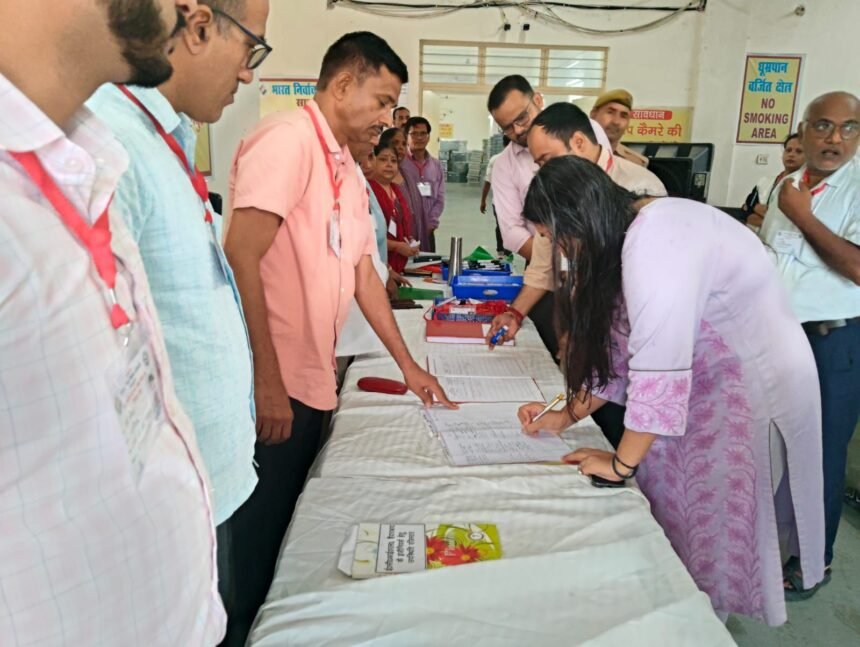 District Election Officer Reviews FLC Work at Warehouse IMAGE CREDIT TO सूचना विभाग