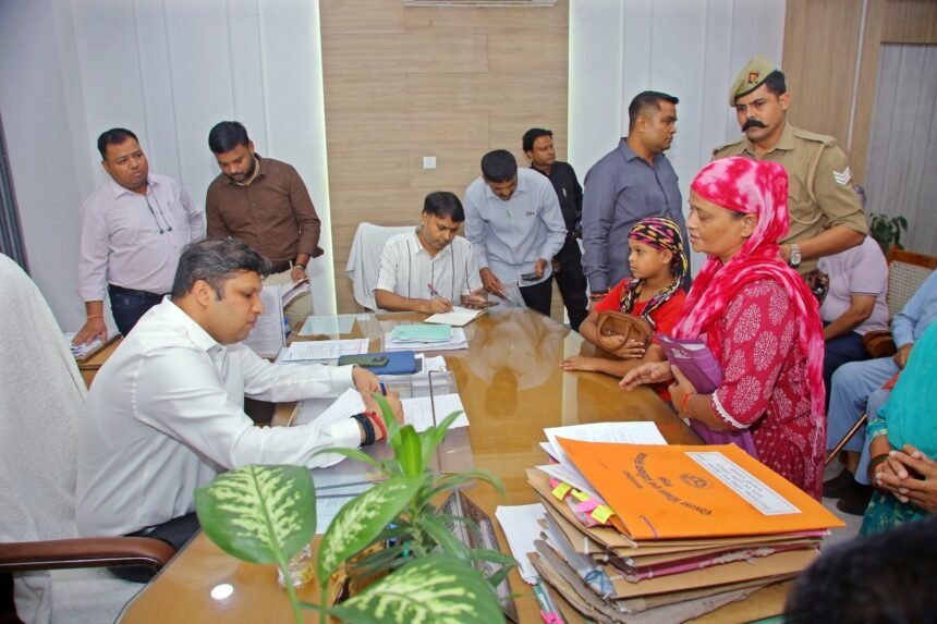 Woman arrives at public grievance hearing with a complaint; officials direct on-the-spot action for an Antyodaya card, pension application and Ayushman card IMAGE CREDIT TO सूचना विभाग