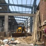 GDA Bulldozer Takes Action Against Illegal Warehouse in Raj Nagar Extension IMAGE CREDIT TO प्राधिकरण
